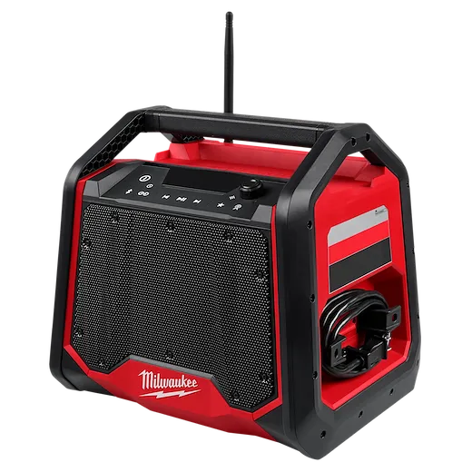 The Milwaukee M18™ Bluetooth® Jobsite Radio + Charger features a sturdy red and black design with a large speaker grille, control buttons on top, and a side compartment for cable storage. The device offers Bluetooth connectivity and charging capabilities for other devices, making it ideal for job sites.