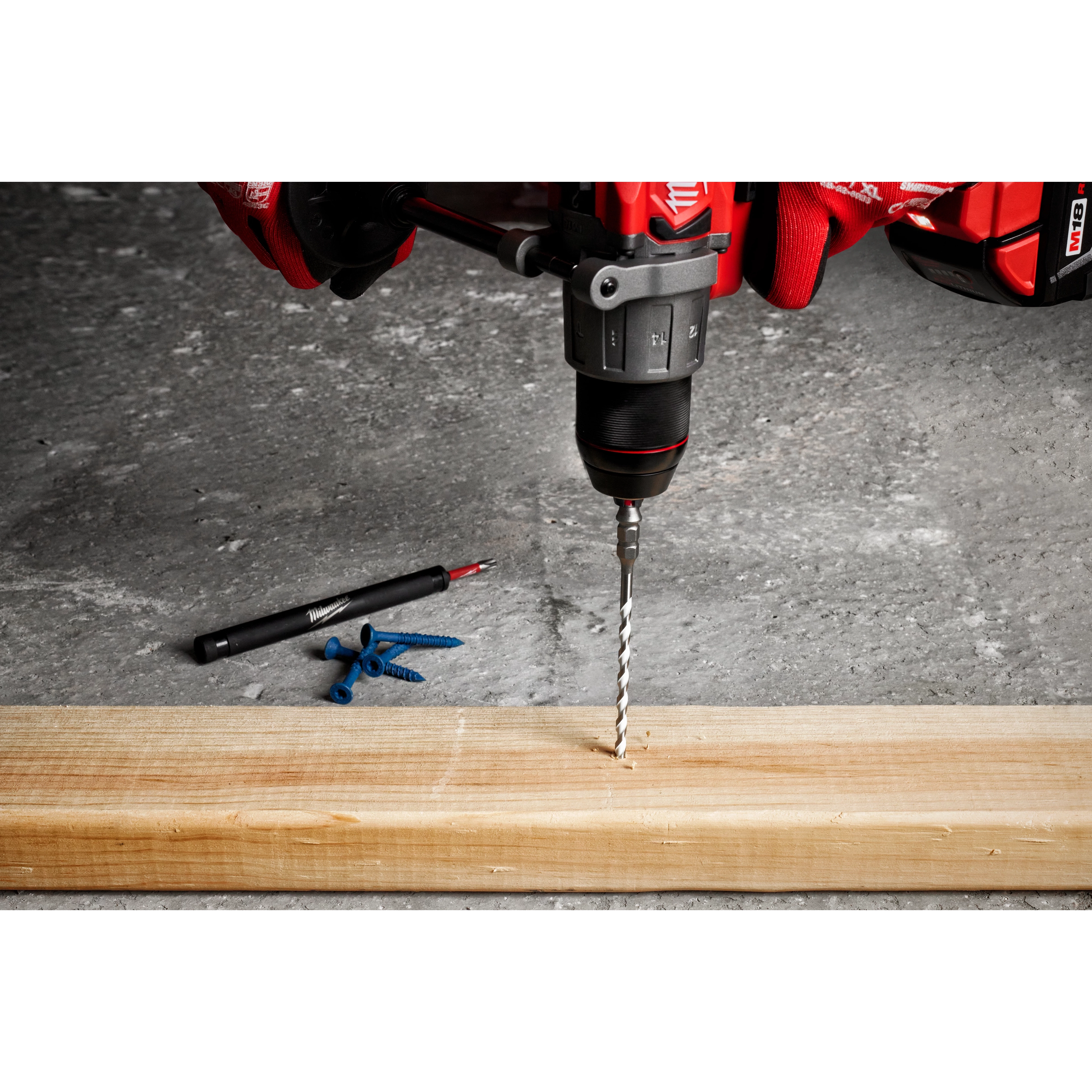 7pc. SHOCKWAVE Impact Duty Carbide Multi-Material Drill Bit Concrete Screw Install Kit being used to drill into a wooden plank.