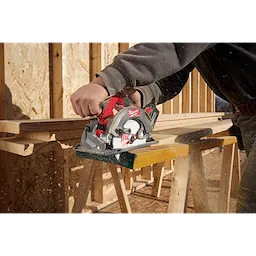 Image of a worker using the Milwaukee M18 FUEL 6-1/2" Circular Saw on a jobsite to cut wood