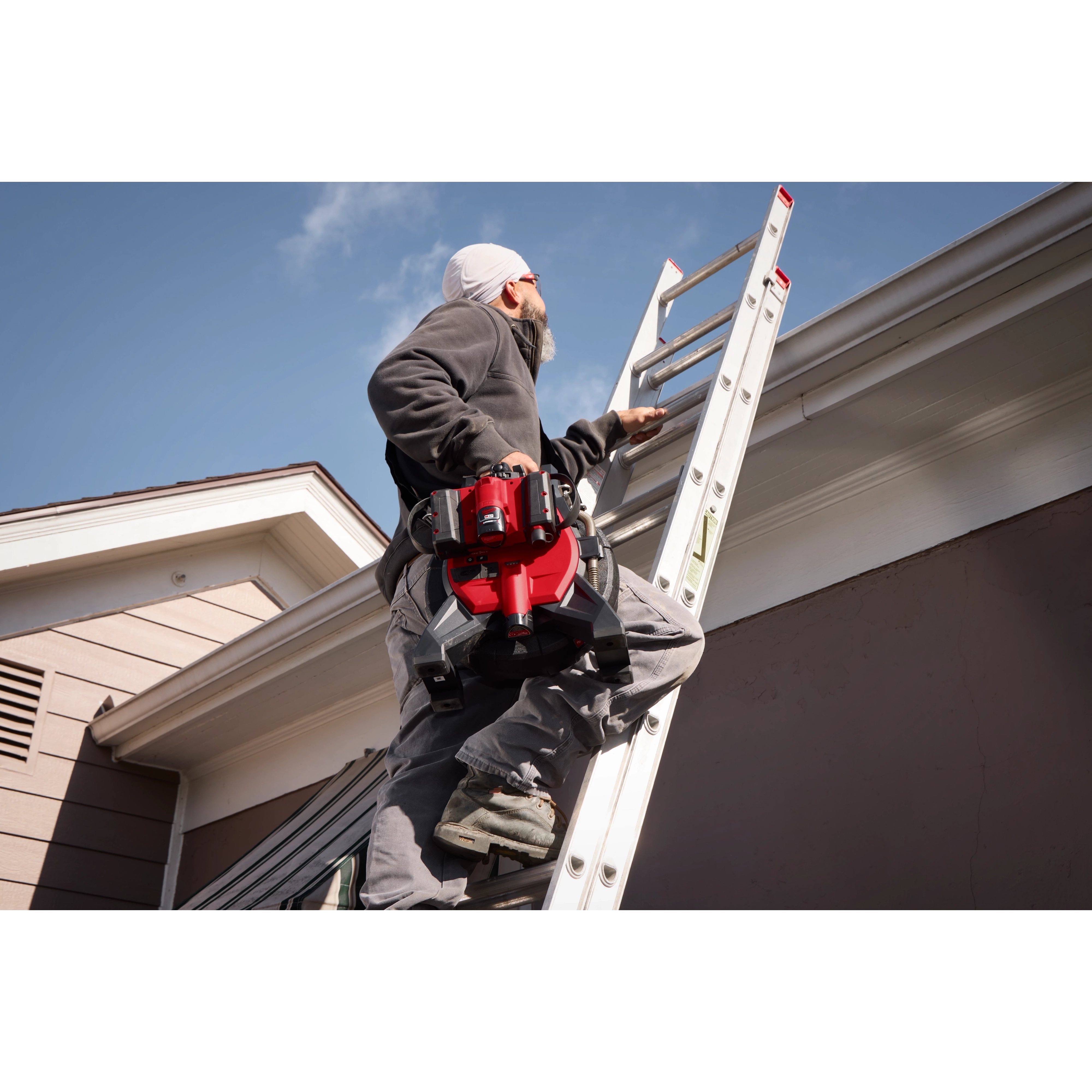 Image of a Milwaukee M12™ 85’ High Flex Compact Inspection Camera Kit being used by a worker on a jobsite