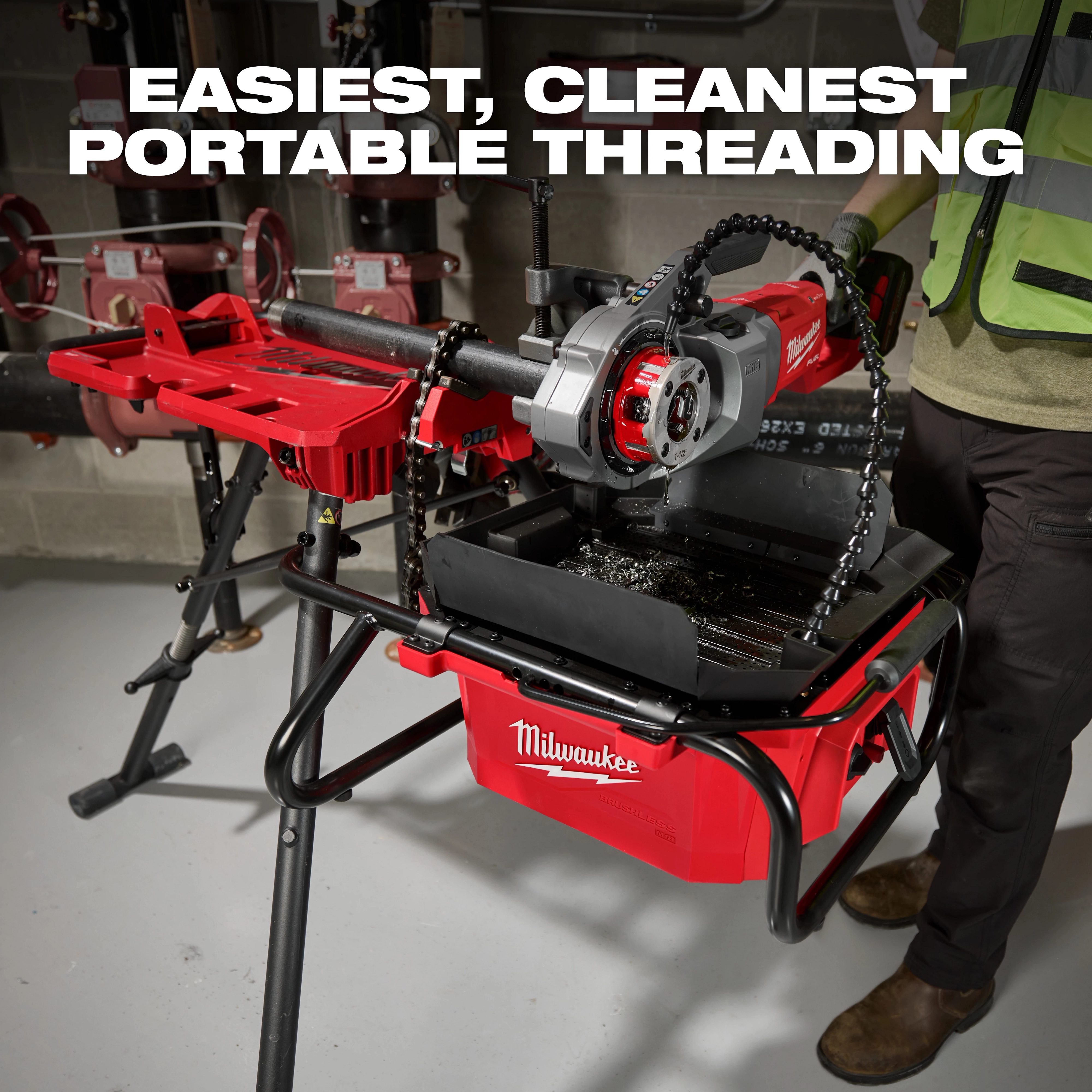 M18 Brushless Pipe Threading Oiler on a stand with a mounted threading tool in an industrial setting.