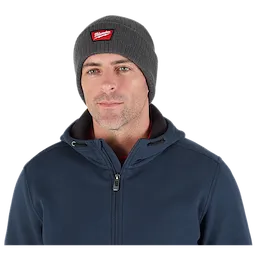 Image of a man wearing the Milwaukee Rib-Knit Cuffed Beanie in gray