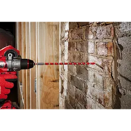 Cordless drill using a 3/8" x 10" x 12" SHOCKWAVE Impact Duty Carbide Hammer Drill Bit to drill into a brick wall.