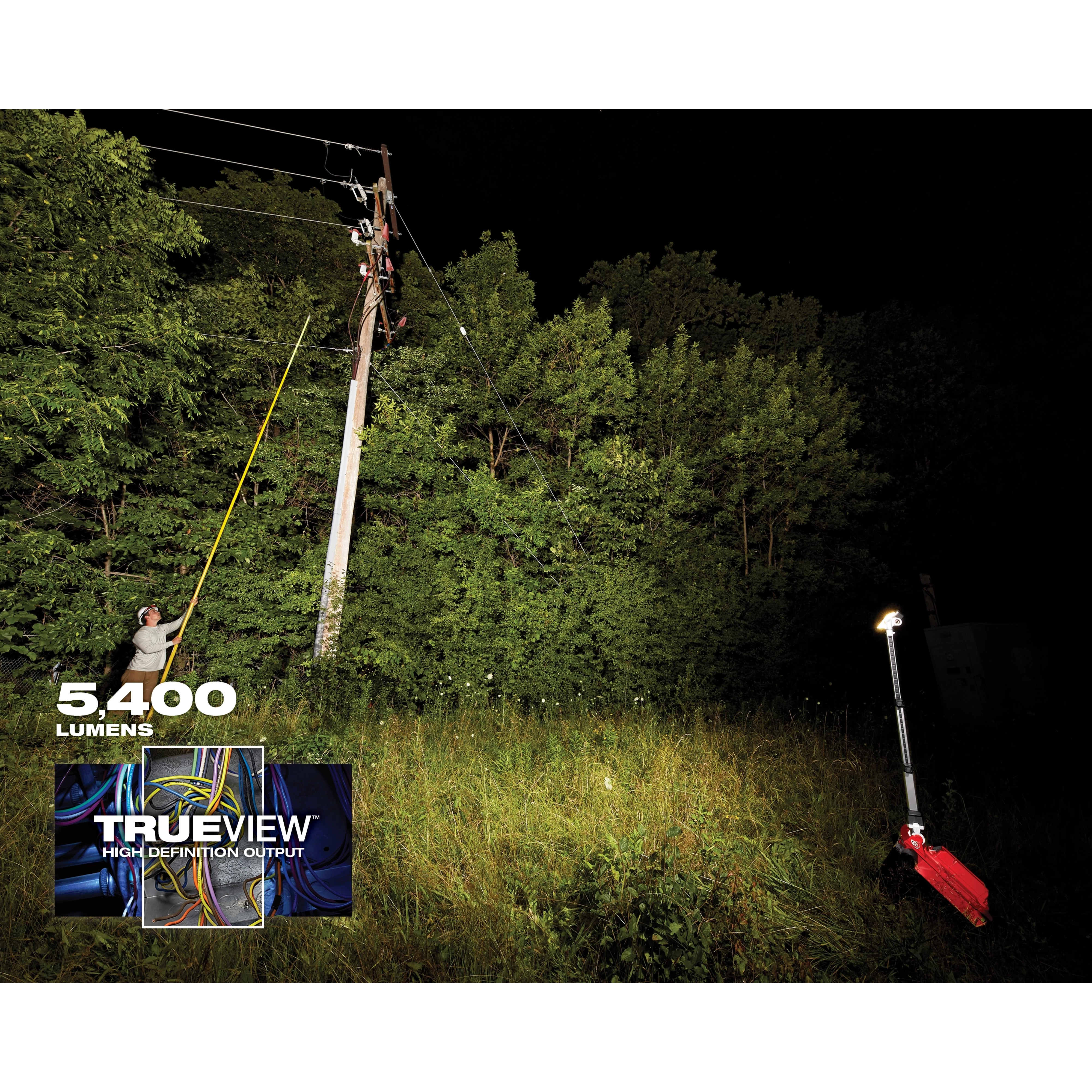 M18 ROCKET Dual Pack Tower Light with ONE-KEY illuminating a worker near a power pole at night in a dense forested area. 