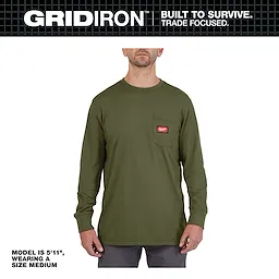 A model wearing a medium-sized, long-sleeve Gridiron Pocket T-Shirt in green with a logo patch on the left chest pocket.
