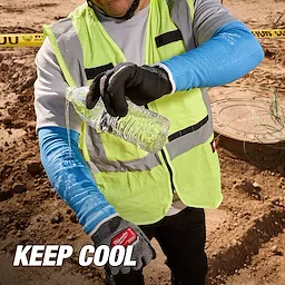 Worker in a neon vest and Cooling Cut Level 1 Protective Sleeves - 16" pours water on a sleeve at a construction site. Text reads "KEEP COOL."