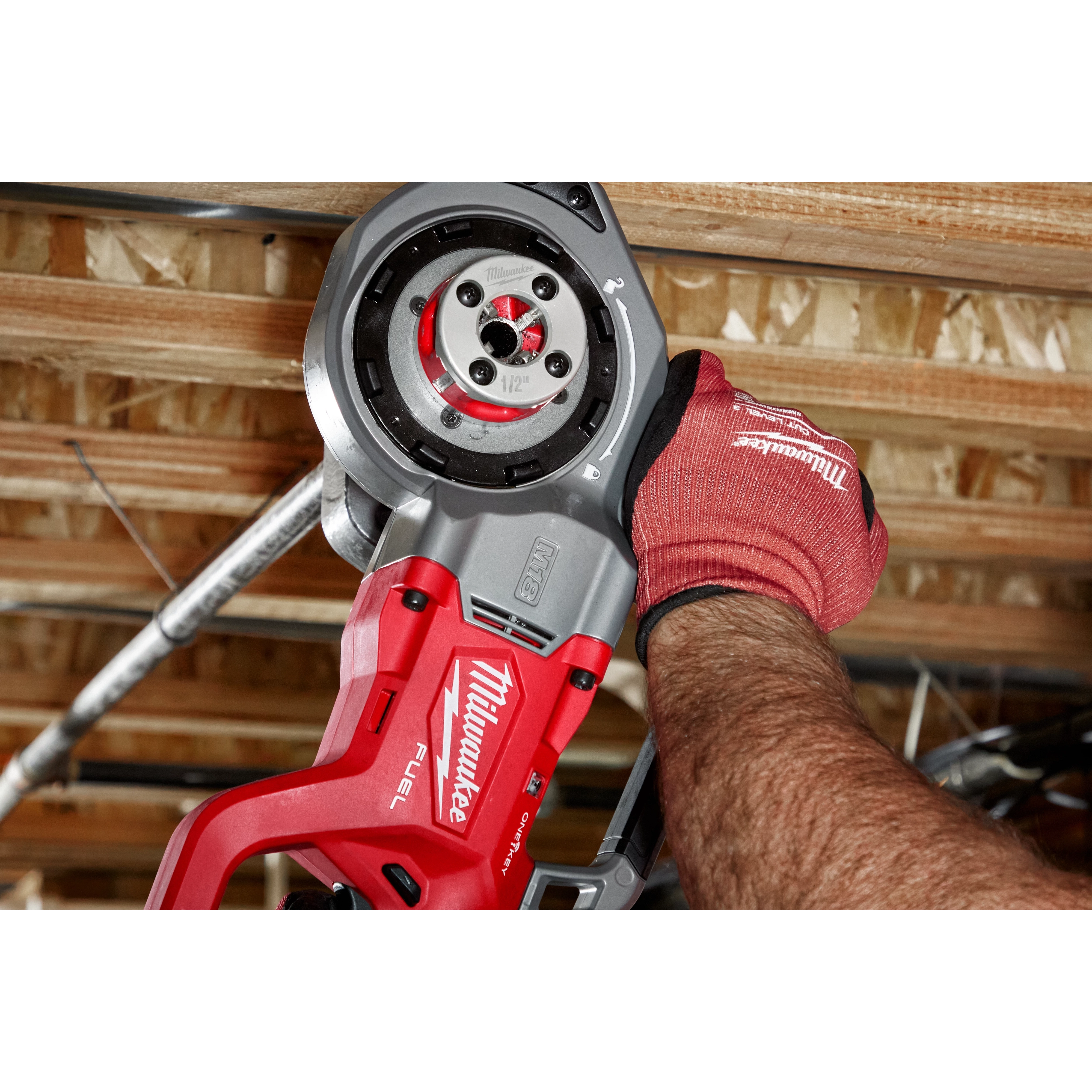 Worker using the 1/2" ALLOY NPT Compact Forged Aluminum Die Head