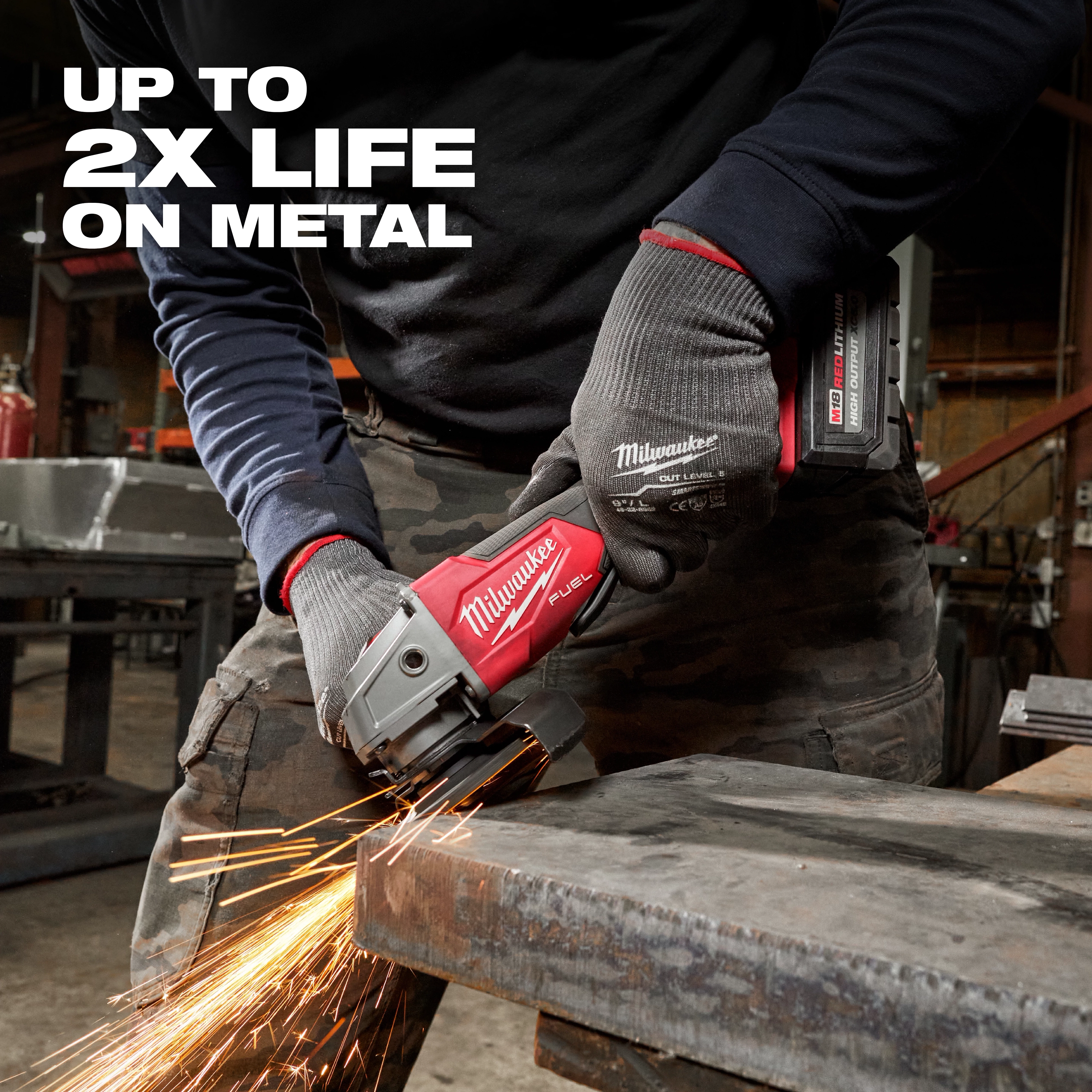 A person using a red and silver cordless angle grinder to grind metal. Text reads "Up to 2X Life on Metal." Bonded Abrasives Grinding.