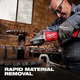 Gloved hands operating a Milwaukee Fuel angle grinder, emitting sparks while working on metal gears. Text: "RAPID MATERIAL REMOVAL".
