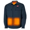 The M12™ Heated Shirt Jacket is dark blue, long-sleeved, and features visible heating elements in the lower front panels. It has two chest pockets and is branded with the logo stitched on the left side of the chest and inside the collar.