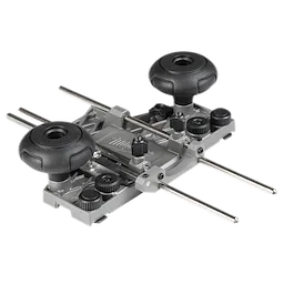 Router Guide Rail Adapter with metallic rods, adjustable knobs, and two black handles on a gray base for precise routing.