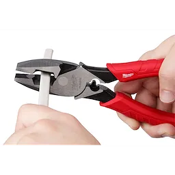 9" High Leverage Lineman's Pliers with Crimper cutting a white cable, featuring red handles and a silver head.