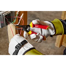 1000V Insulated 10-20 AWG Wire Stripper & Cutter being used by a person wearing protective gloves to strip wires.