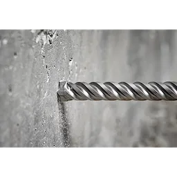 The MILWAUKEE® MX4™ 4-Cutter SDS MAX Rotary Hammer Drill Bits 3/4" X 8" X 13" drilling into a concrete wall