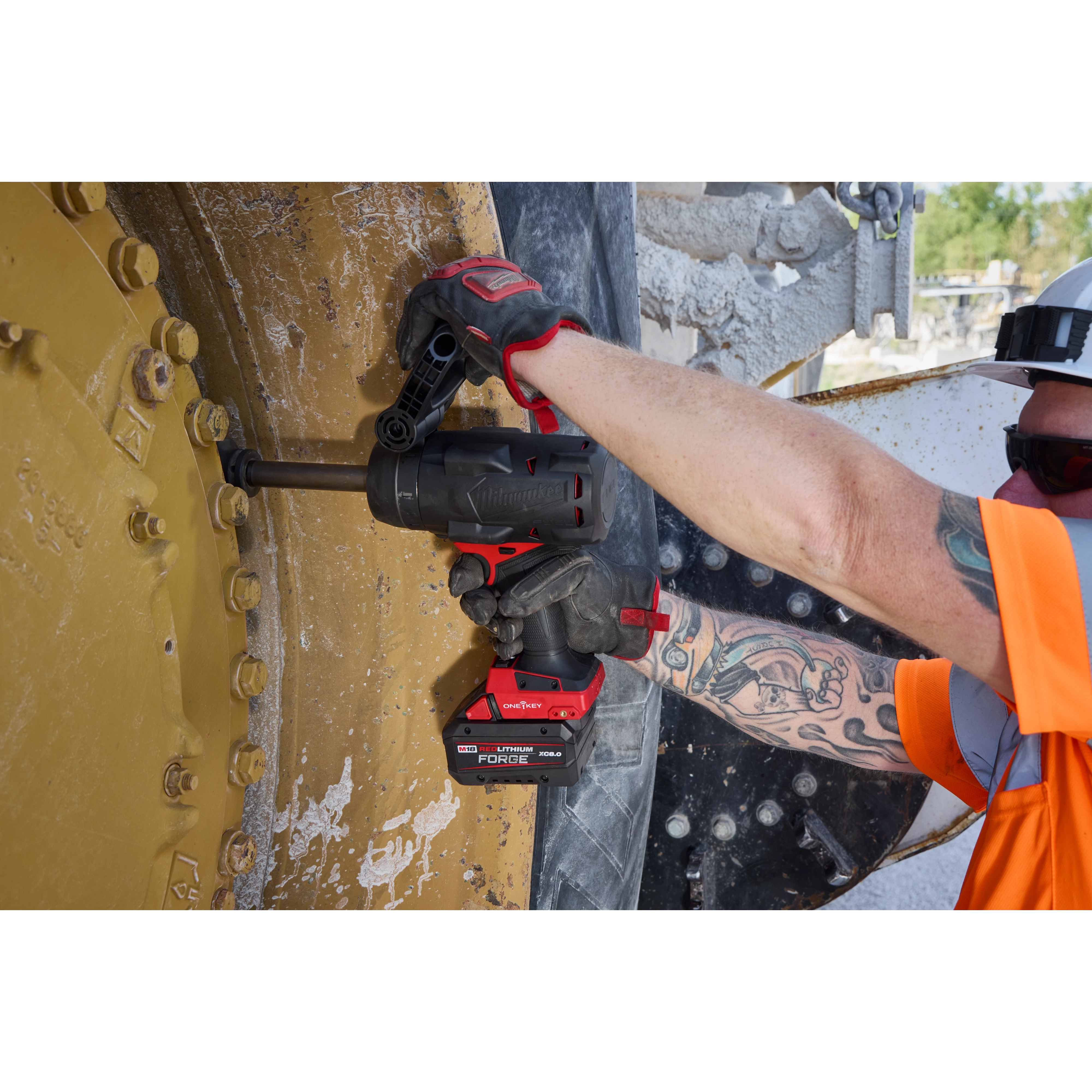 M18 FUEL 3/4" Extended Anvil High Torque Impact Wrench w/ ONE-KEY used on large bolted machinery wheel.