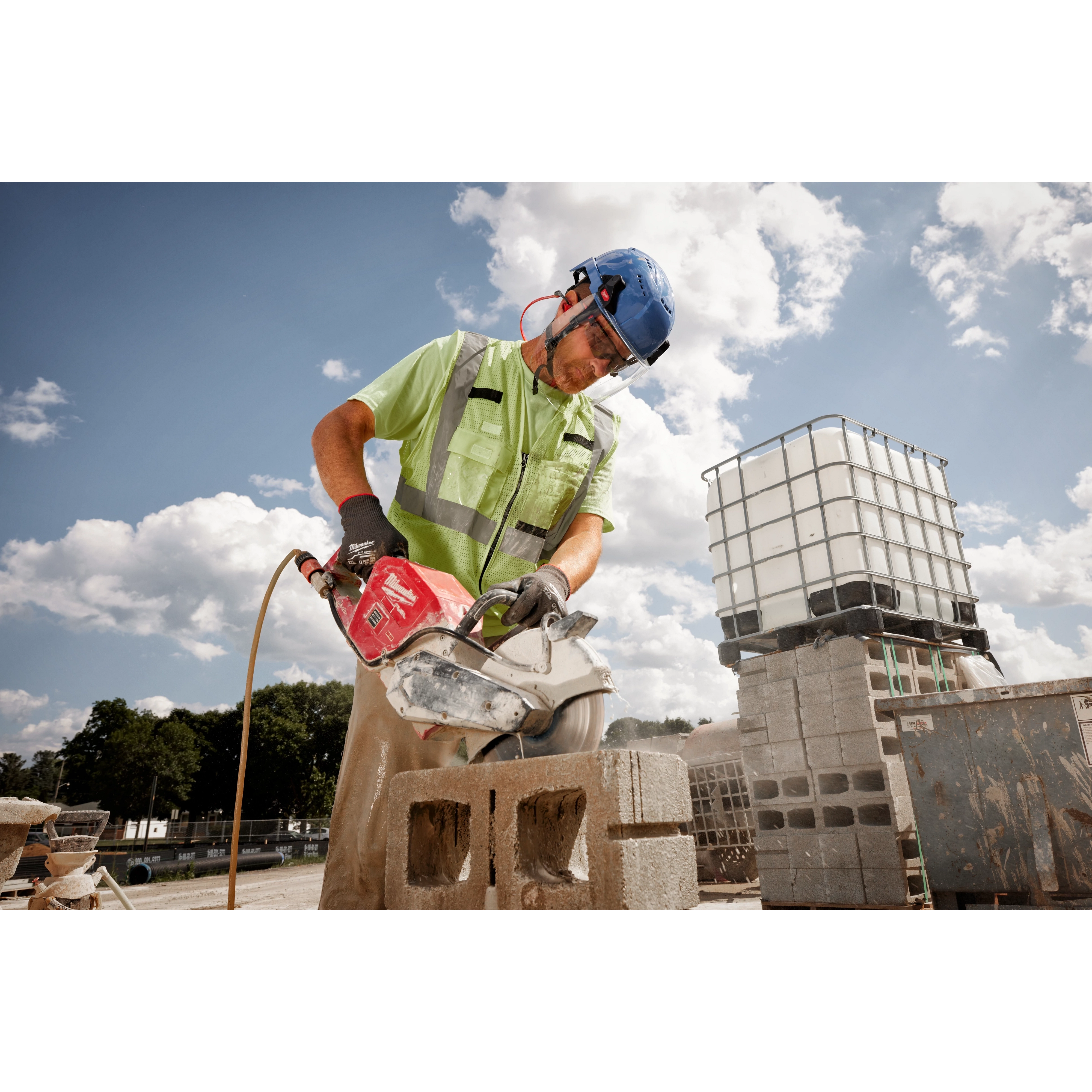 Worker wearing the BOLT Full Face Shield Clear Dual Coat Lens while chipping concrete