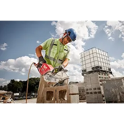 Worker wearing the BOLT Full Face Shield Clear Dual Coat Lens while chipping concrete
