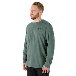 Man wearing a green FREEFLEX Hybrid Work Tee - Long Sleeve. The shirt features a small brand logo on the upper left chest.
